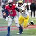 Michigan defensive end Craig Roh tries to tackle Ohio State quarterback Braxton Miller on Saturday. Daniel Brenner I AnnArbor.com